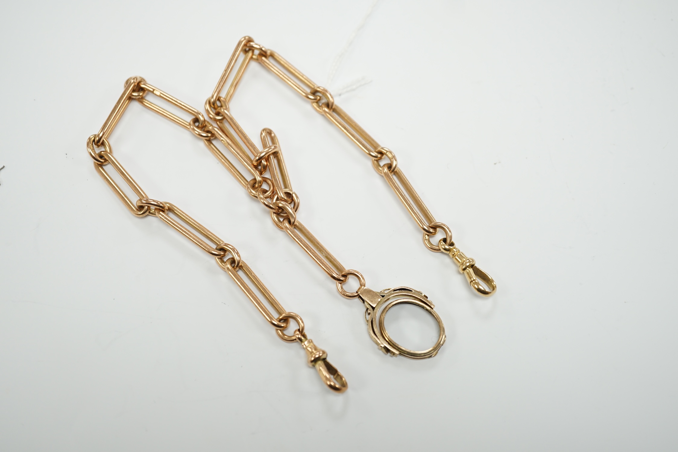 An early 20th century 9ct gold albert, hung with a damaged yellow metal spinning fob, length 43cm